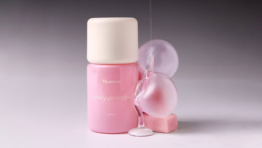 A parfum bottle photographed in soft, quiet light against a pale gradient