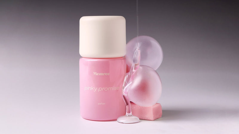 A parfum bottle photographed in soft, quiet light against a pale gradient